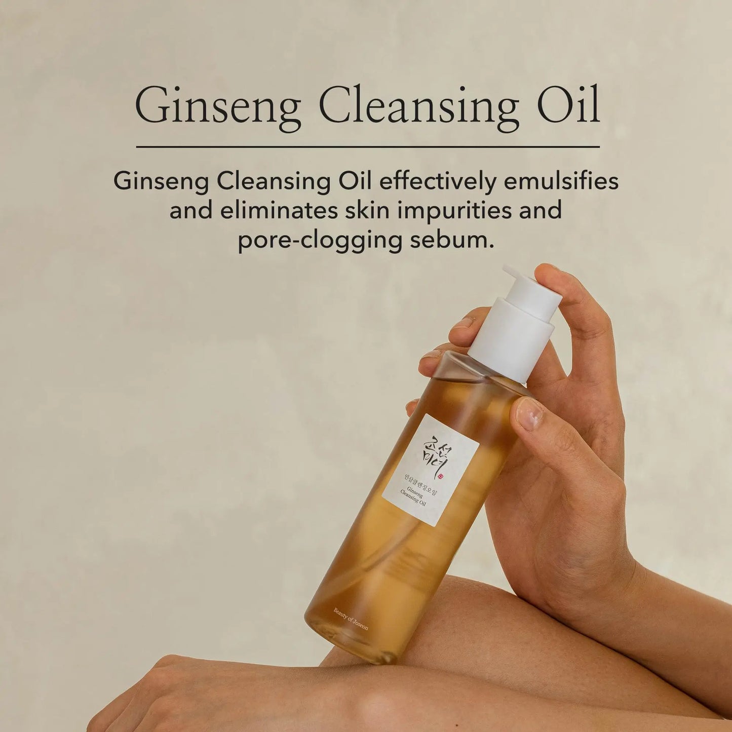 Hand holding a bottle of Beauty of Joseon Ginseng Cleansing Oil 210ml with text describing its ability to emulsify and remove skin impurities and pore-clogging sebum.