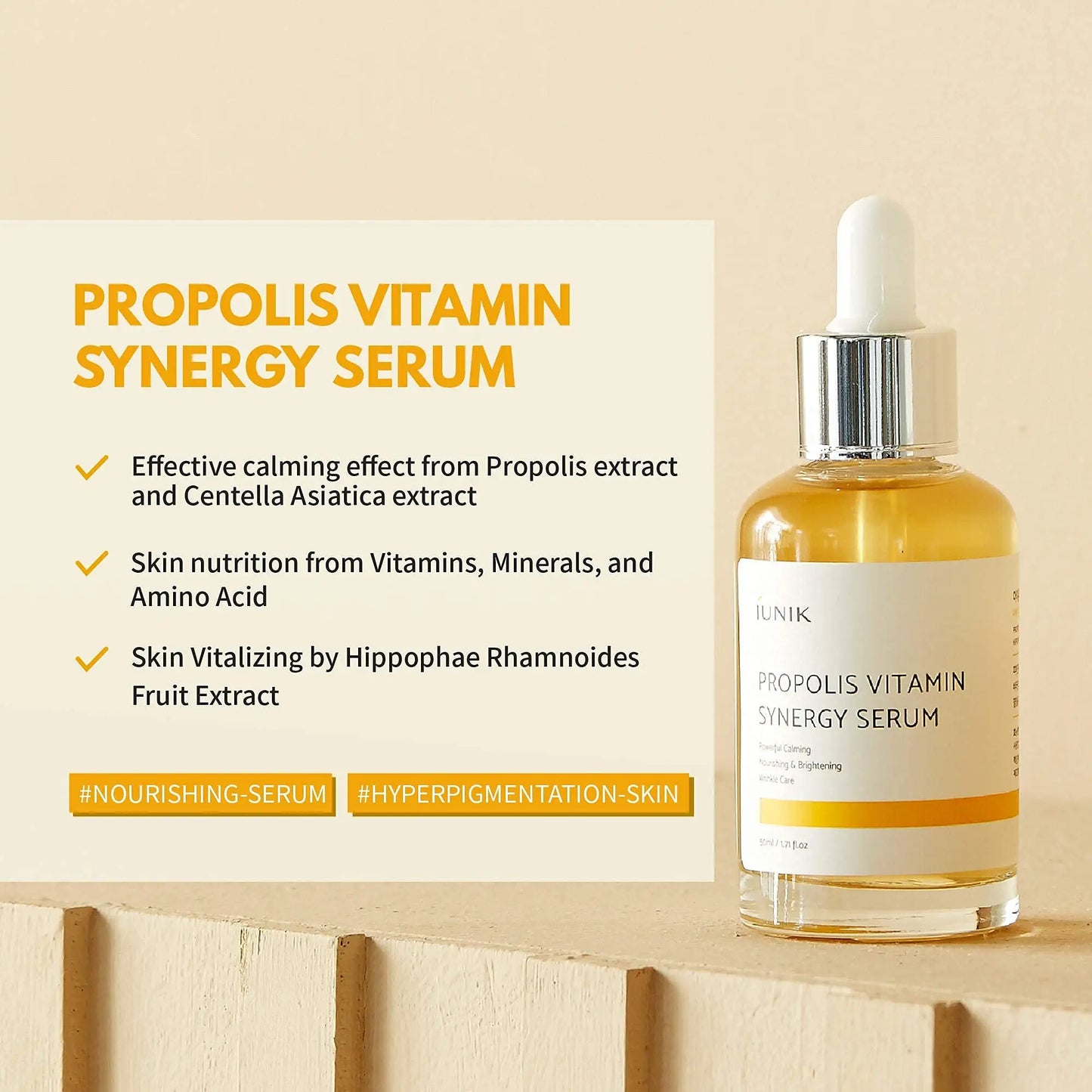 Clear glass dropper bottle of iUNIK Propolis Vitamin Synergy Serum, 50ml with yellow liquid beside text highlighting calming, nourishing, and vitalizing skin benefits from Propolis and Centella Asiatica extract.