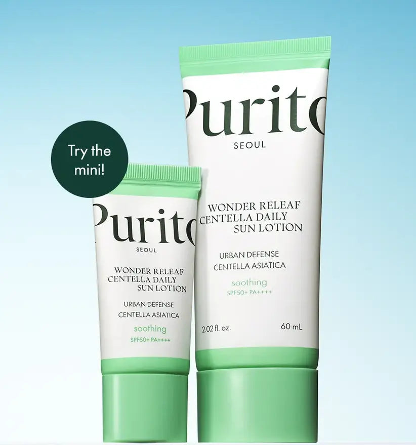 Two tubes of PURITO Wonder Releaf Centella Daily Sun Lotion in different sizes on a blue gradient background, highlighting SPF50+ and soothing skincare benefits.