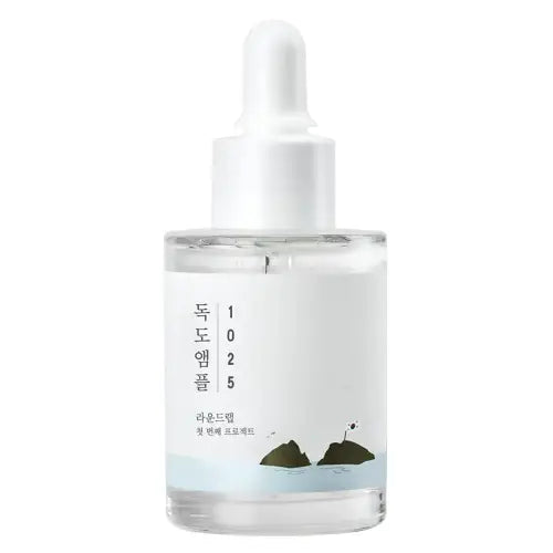 Clear glass bottle with white dropper cap and minimalist label featuring korean text and islands for round lab 1025 dokdo ampoule serum 45g