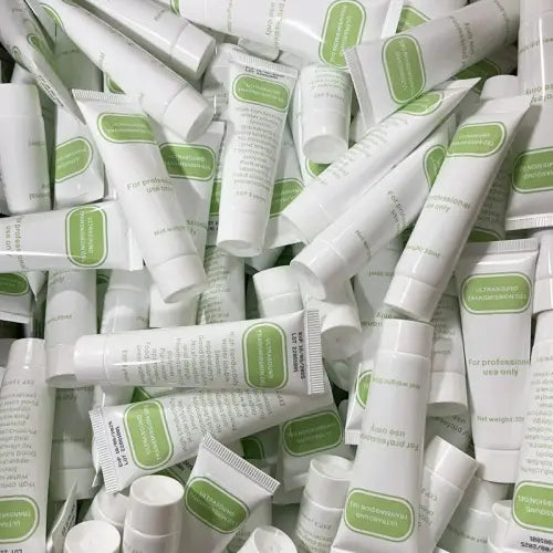 White plastic tubes of ultrasound transmission gel with green labeling for professional use with fetal dopplers 30ml