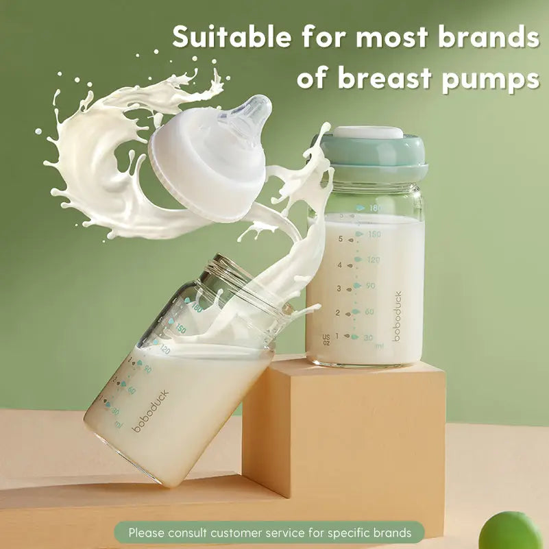 Two glass baby milk storage bottles filled with milk, one tipped and the other upright, with milk splashing around a wide-neck nipple, highlighting the All-in-One Wide-Neck Glass Baby Milk Storage Bottle | Pump Directly into Bottle Store in Refrigrator and Feed Directly from Glass Bottle| BPA-Free | Glass Breas suitable for most brands of breast pumps.