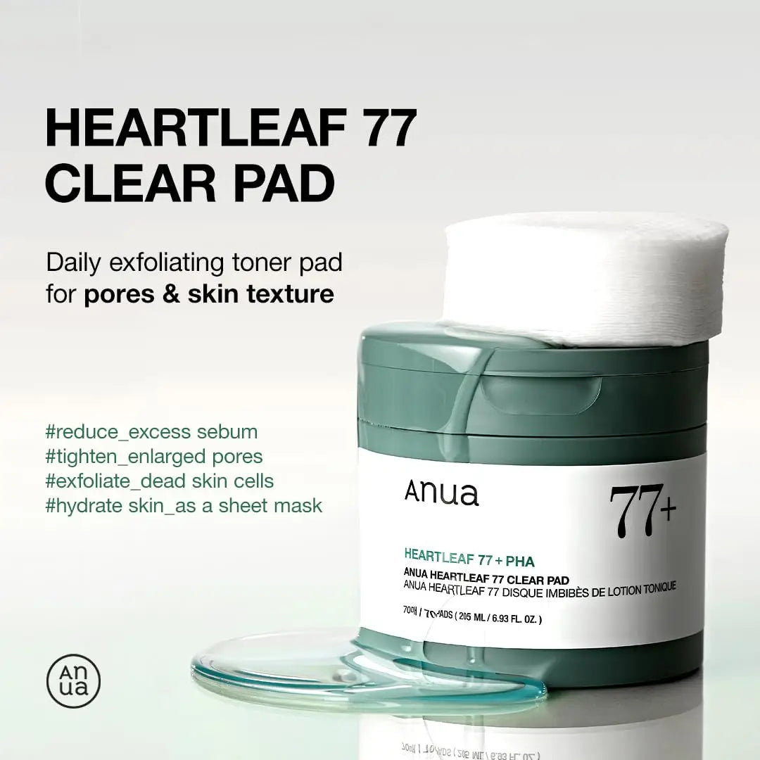 Container of ANUA Heartleaf 77 Clear Pad daily exfoliating toner pads with one white pad resting on top and clear pads scattered nearby, promoting skin benefits.