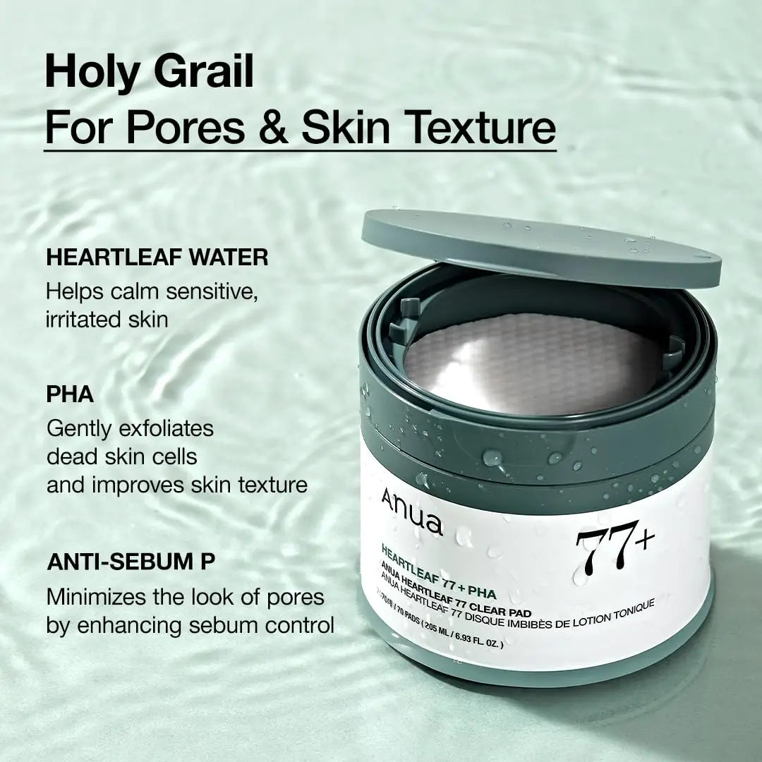 Open container of ANUA Heartleaf 77 Clear Pad showing textured pads inside, with water droplets on the dark green jar placed on a rippled water surface background, alongside text highlighting benefits for pores and skin texture.