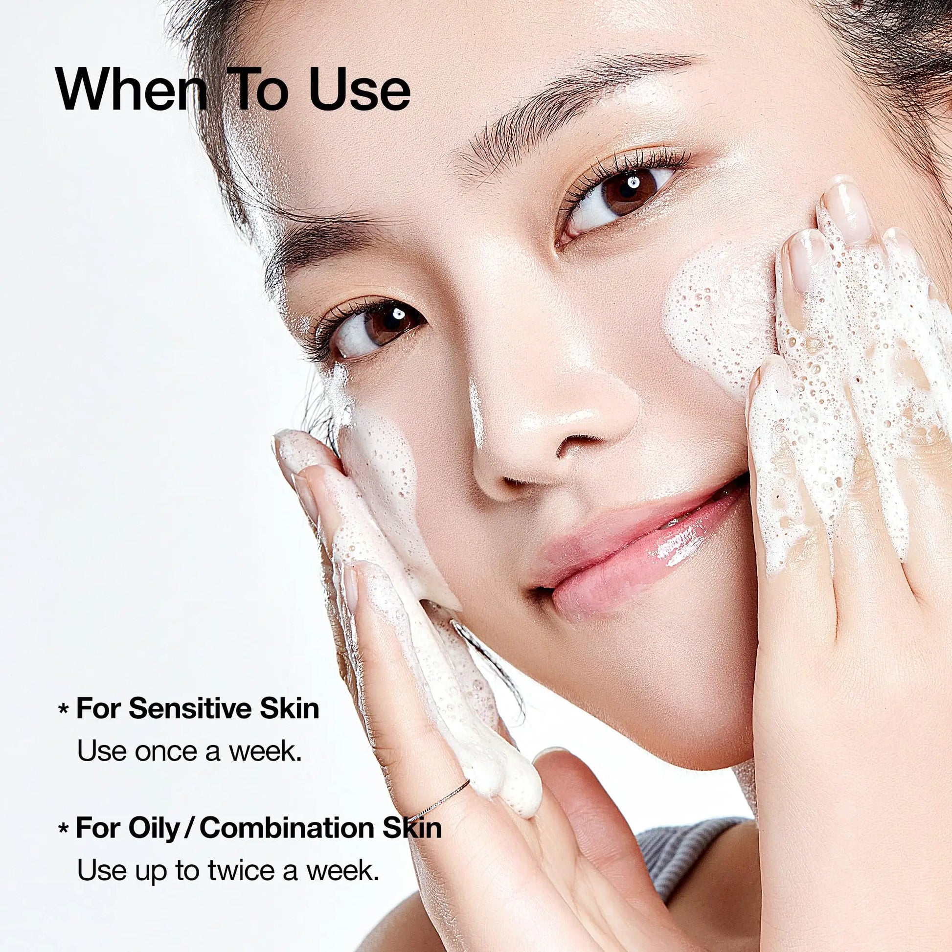 Close-up of a woman gently cleansing her face with foam, illustrating usage instructions for Anua ANUA Heartleaf LHA Moisture Peeling Gel 120ml for sensitive and oily/combination skin.