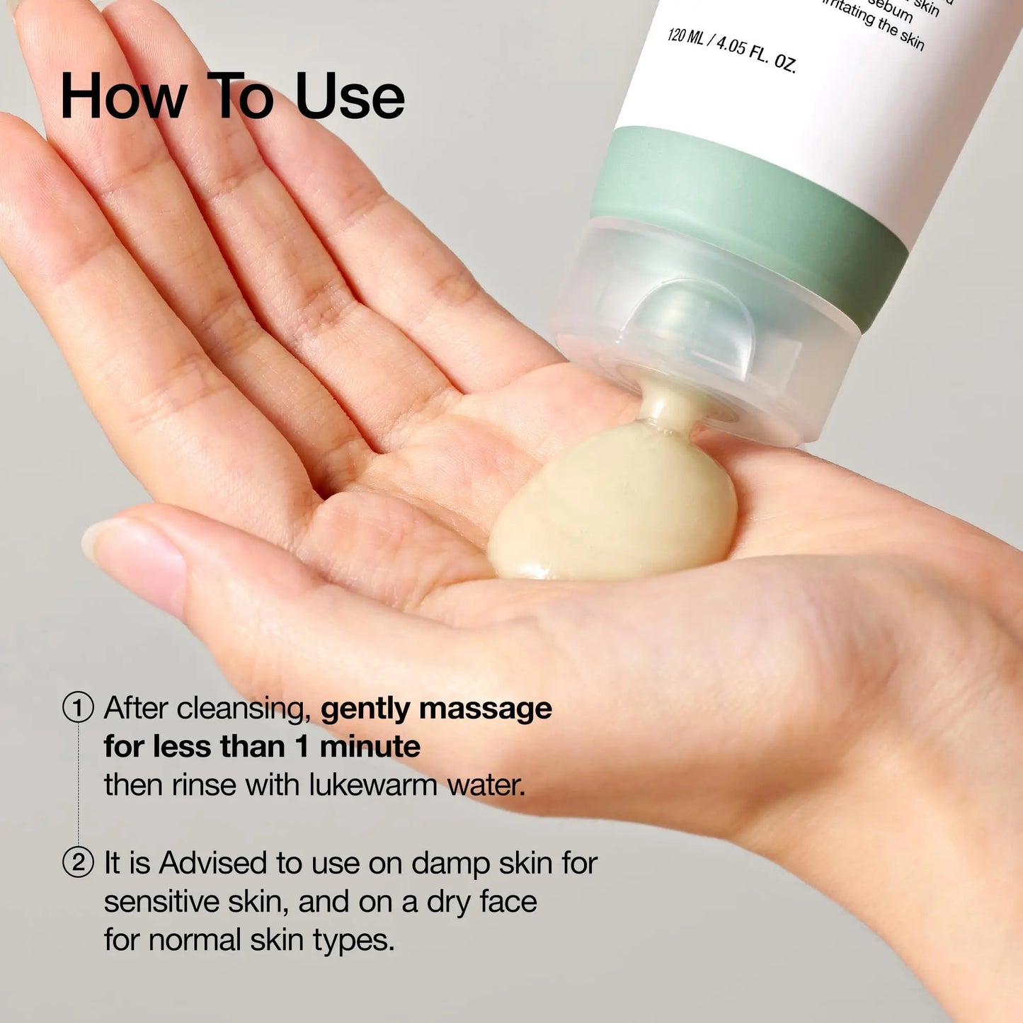 Hand holding beige gel being dispensed from a tube with usage instructions, demonstrating application of Anua ANUA Heartleaf LHA Moisture Peeling Gel 120ml for gentle facial massage and rinsing.