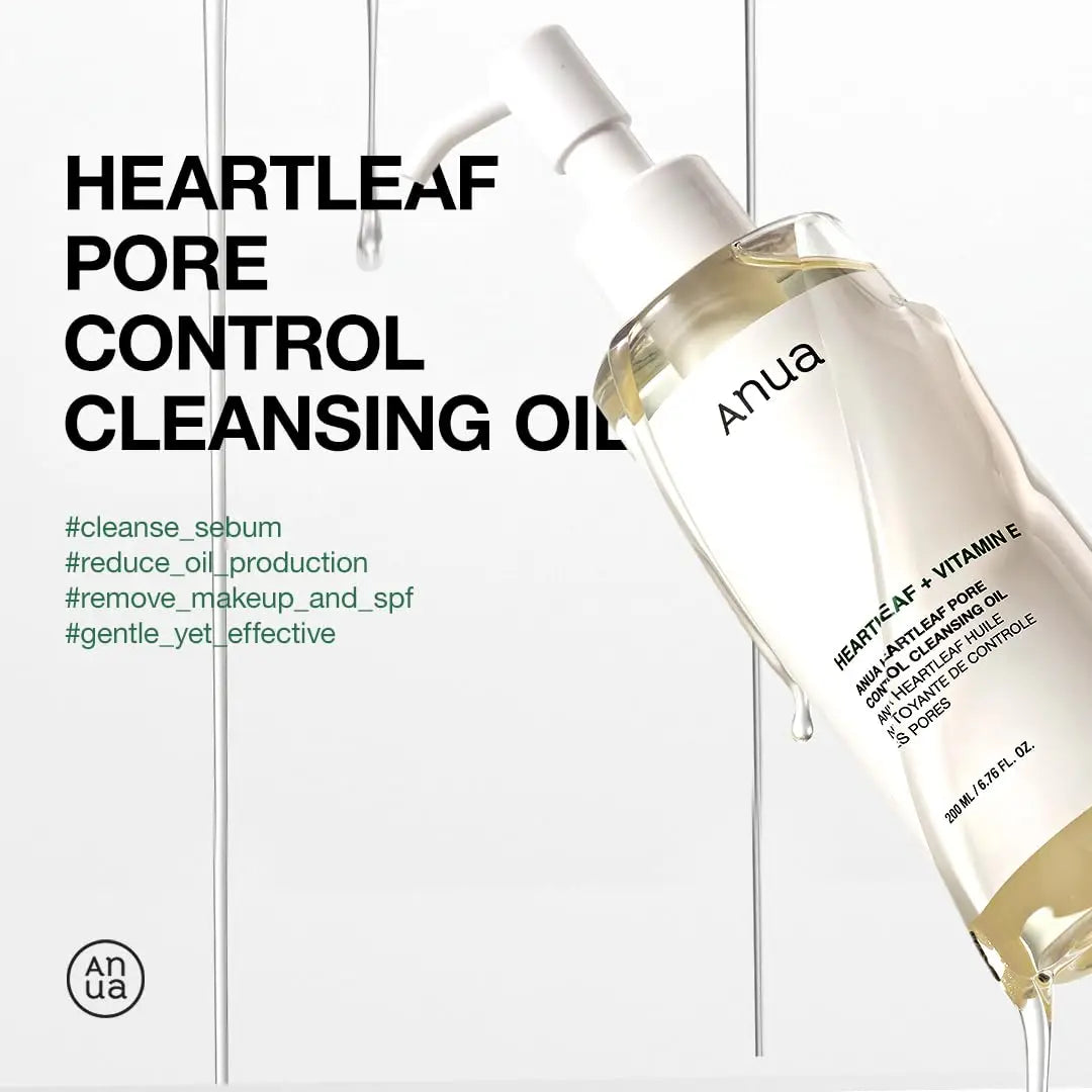 Clear bottle of Anua Heartleaf Pore Control Cleansing Oil 200ml with pump dispenser and drops of oil falling around against a white background with product benefits text.