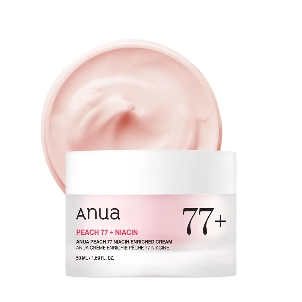 An open jar of Anua Peach 77 Niacin Enriched Cream 50ml showing smooth, light peach-colored cream in a white and pink container with clear labeling.