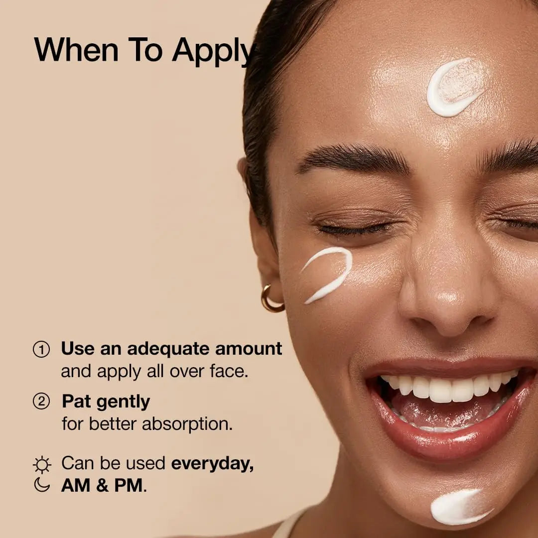 Close-up of a smiling woman with creamy moisturizer applied on forehead, cheeks, and chin, demonstrating when and how to apply Anua Rice 70 Intensive Moisturizing Milk 50ml for daily skincare use.