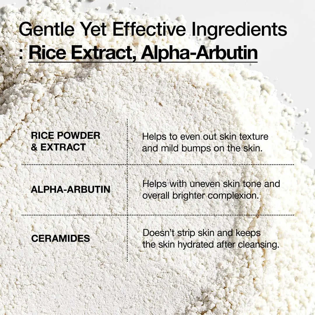Close-up view of fine white powder with text highlighting gentle yet effective ingredients including rice extract, alpha-arbutin, and ceramides for brightening and hydrating skin in Anua Rice Enzyme Brightening Cleansing Powder 40g.