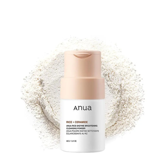 Anua Rice Enzyme Brightening Cleansing Powder 40g bottle with light beige cap surrounded by a scattered pile of fine white cleansing powder on a white background.
