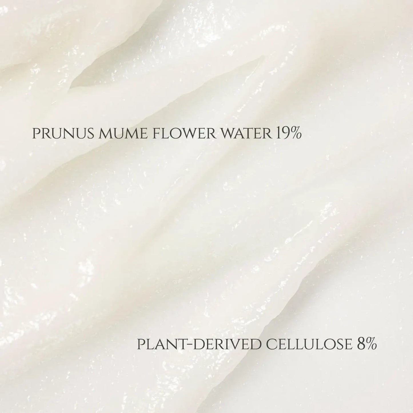 Close-up texture of creamy white peeling gel highlighting key ingredients Prunus Mume Flower Water 19% and plant-derived cellulose 8% for Beauty of Joseon Apricot Blossom Peeling Gel 100ml.