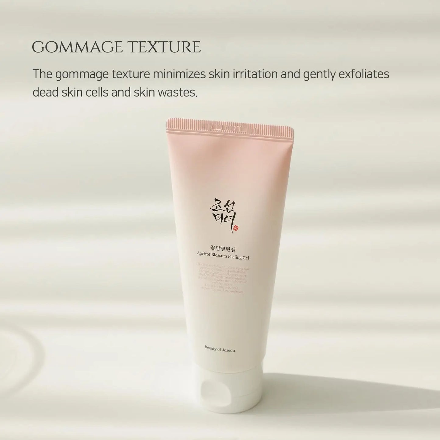 Beauty of Joseon Apricot Blossom Peeling Gel 100ml in a soft pink and white tube, highlighting its gommage texture that gently exfoliates dead skin cells and reduces irritation.