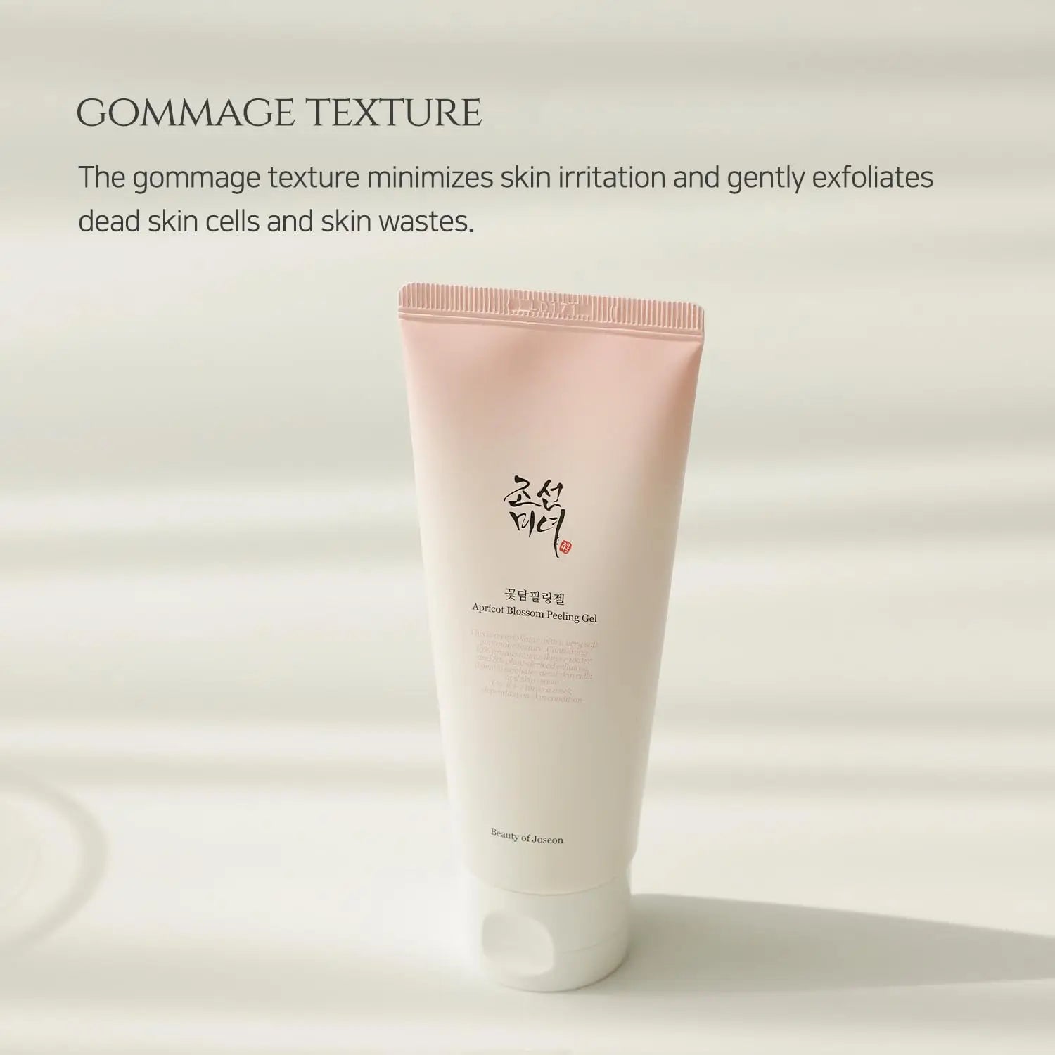 Beauty of Joseon Apricot Blossom Peeling Gel 100ml in a soft pink and white tube, highlighting its gommage texture that gently exfoliates dead skin cells and reduces irritation.