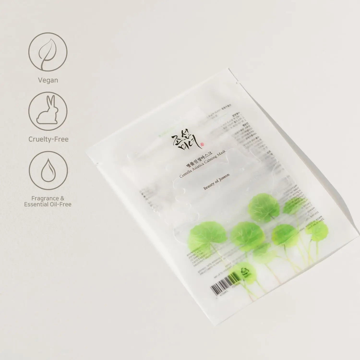 Transparent packaging of Beauty of Joseon Centella Asiatica Calming Mask with illustrations of centella leaves, highlighting vegan, cruelty-free, and fragrance-free qualities.