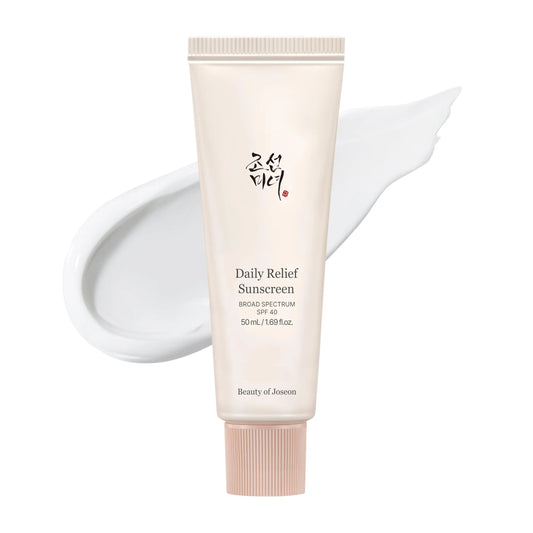 Beauty of Joseon Daily Relief Sunscreen Broad Spectrum SPF 40 50ml tube with a smooth white sunscreen cream swatch in the background.