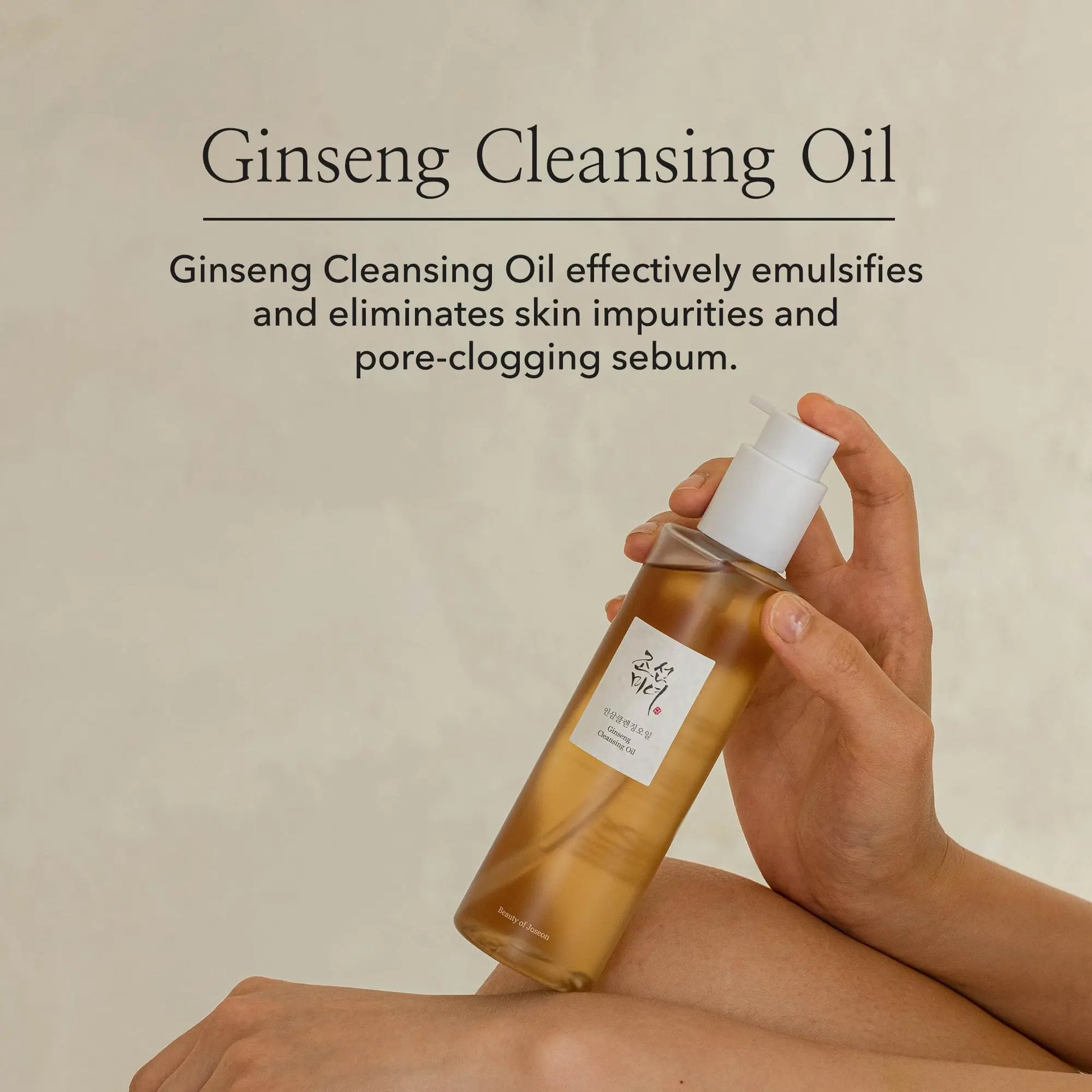 Hand holding a bottle of Beauty of Joseon Ginseng Cleansing Oil 210ml with text describing its ability to emulsify and remove skin impurities and pore-clogging sebum.