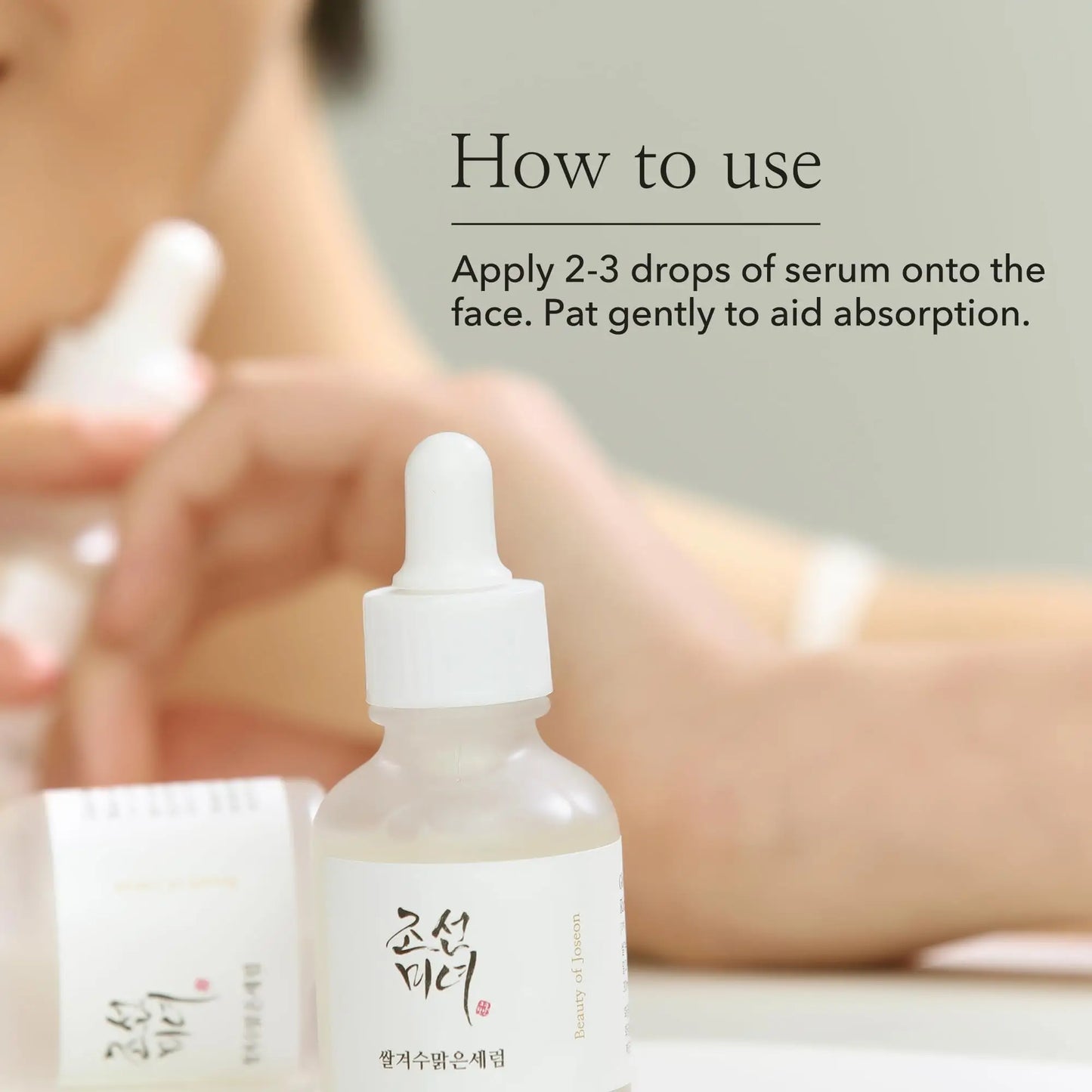 Bottle of Beauty of Joseon Glow Deep Serum Rice + Alpha-Arbutin 30ml with instructions on how to use, showing a hand holding a dropper to apply serum onto the face.