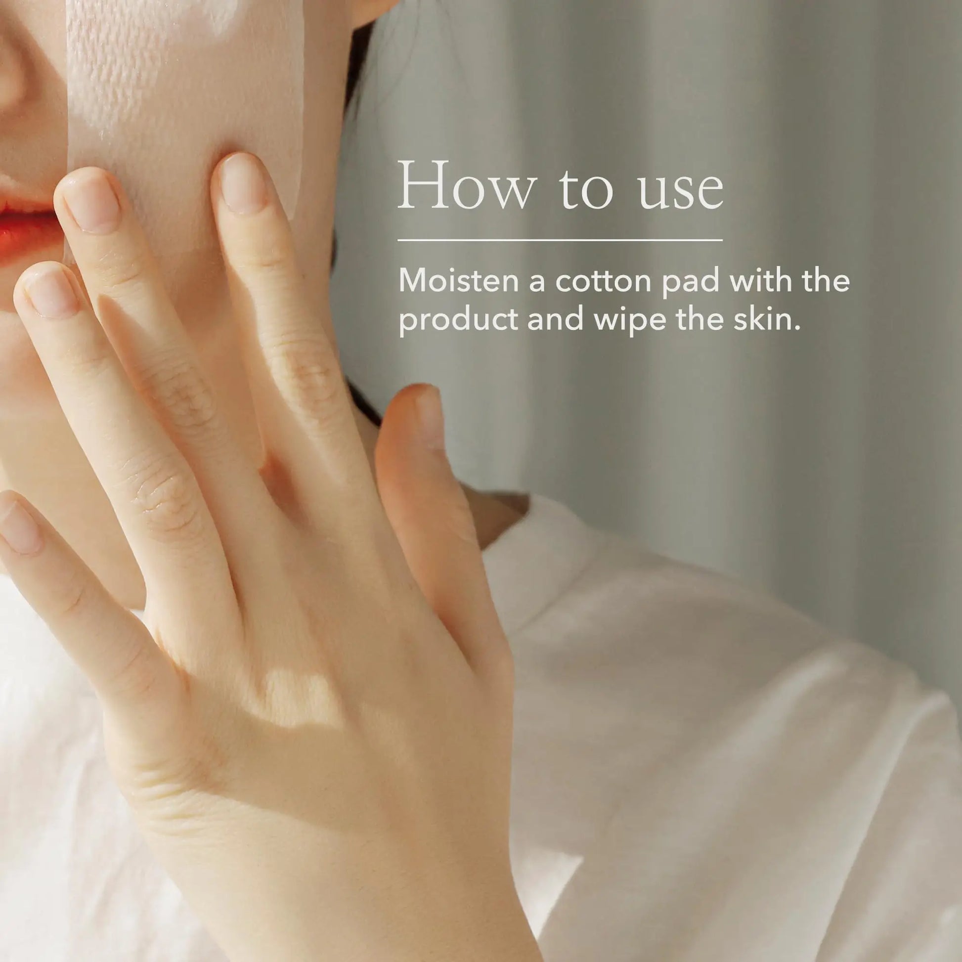 Close-up of a person gently pressing a moistened cotton pad to their cheek with text explaining how to use Beauty of Joseon Green Plum Refreshing Toner AHA BHA 150ml by wiping the skin with the pad.