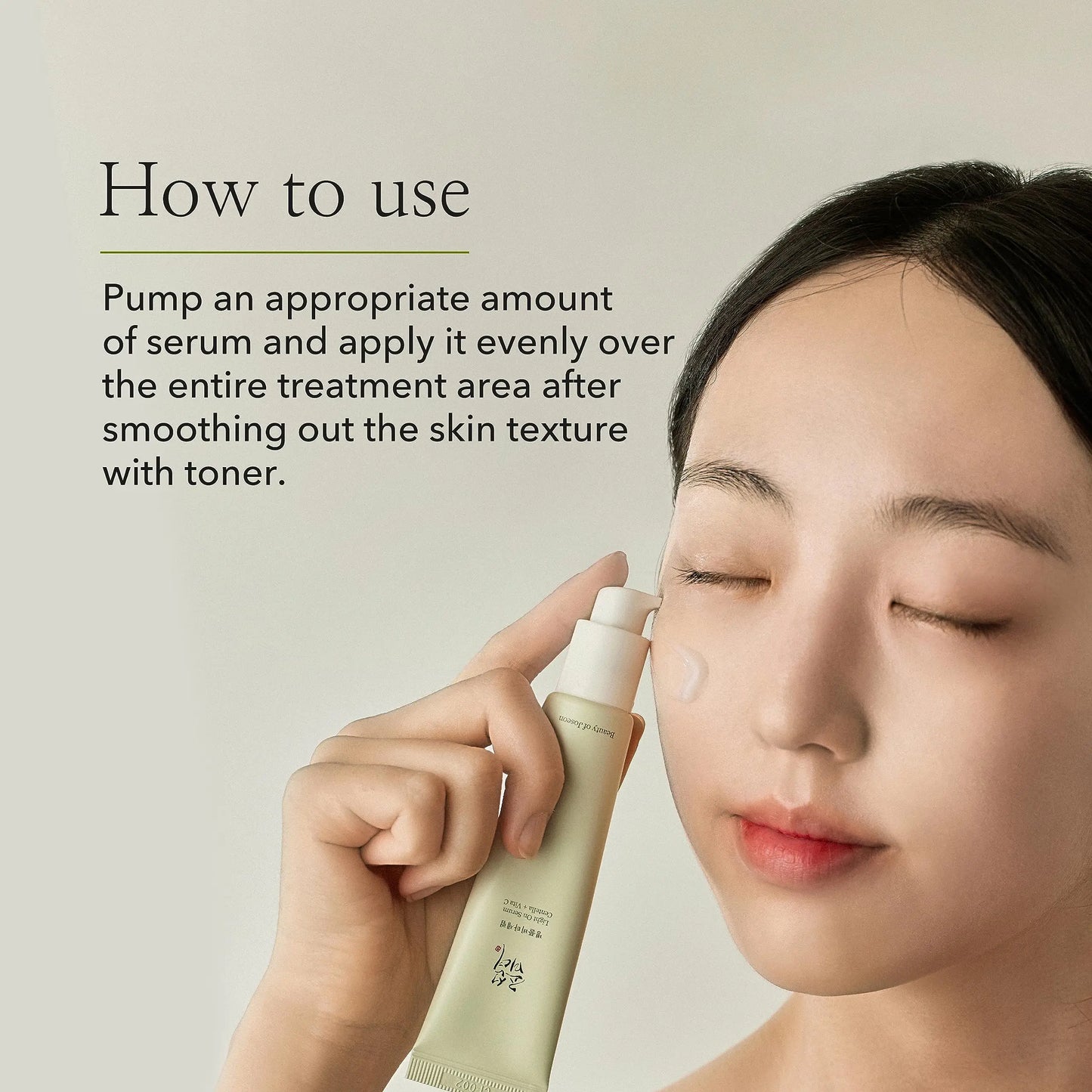 Woman with clear skin applying Beauty of Joseon Light On Serum Centella + Vitamin C 30ml to her cheek, demonstrating skincare application with eyes closed.