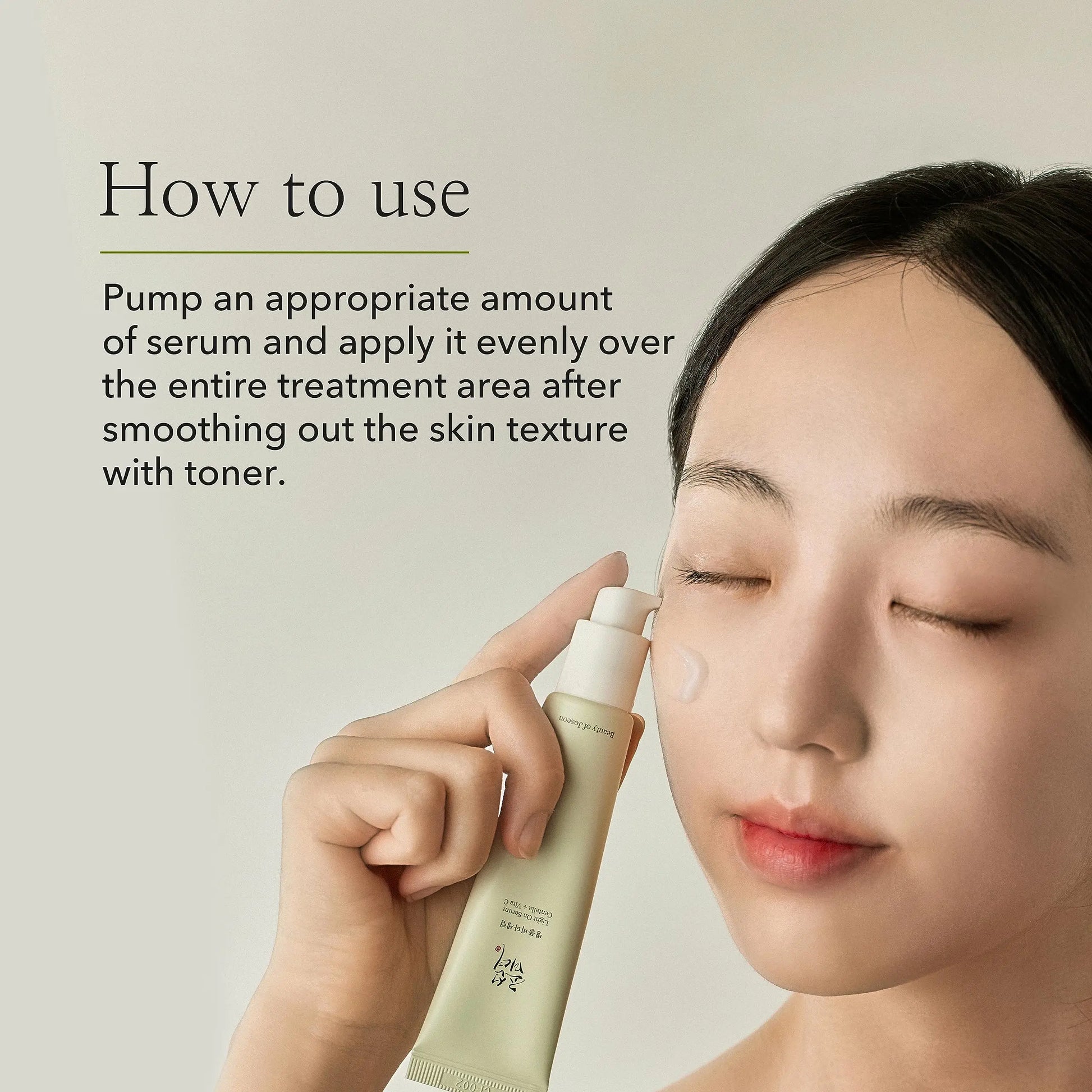 Woman with clear skin applying Beauty of Joseon Light On Serum Centella + Vitamin C 30ml to her cheek, demonstrating skincare application with eyes closed.