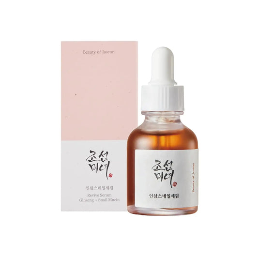 Beauty of Joseon Revive Snail Mucin Ginseng Serum 30ml bottle with dropper next to its pink and white packaging box, designed for skincare use.
