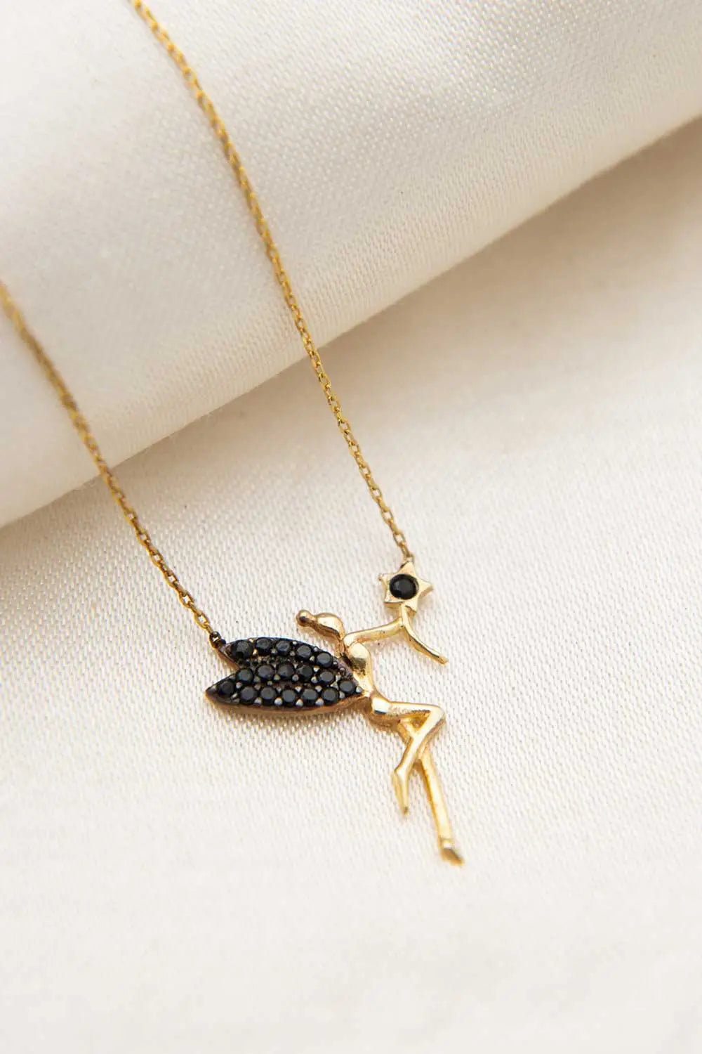 Einzelstück - 14K Gold Plated Fairy Necklace with Black Zircona stones - delicate gold chain featuring a fairy pendant adorned with black zirconia stones on wings and head.