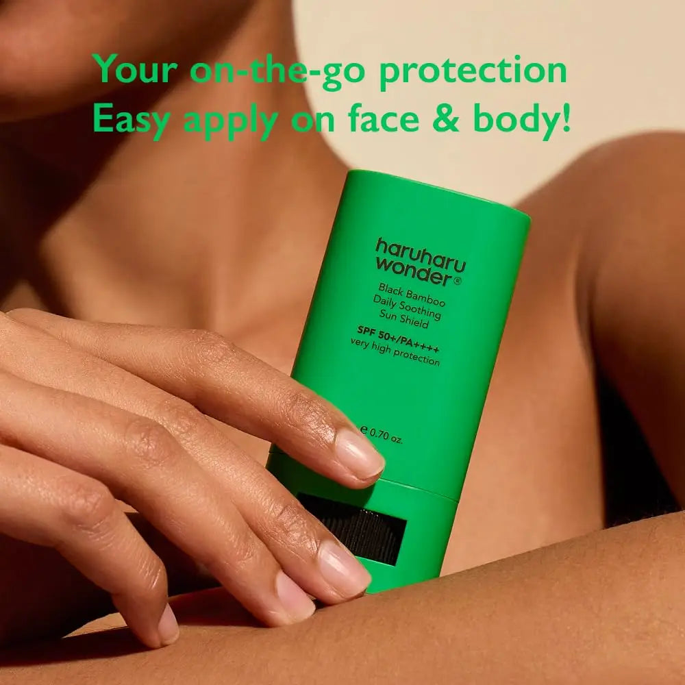 Close-up of a person applying haruharu wonder Black Bamboo Daily Soothing Sun Shield Sunscreen Stick 20g with text highlighting easy application for face and body protection