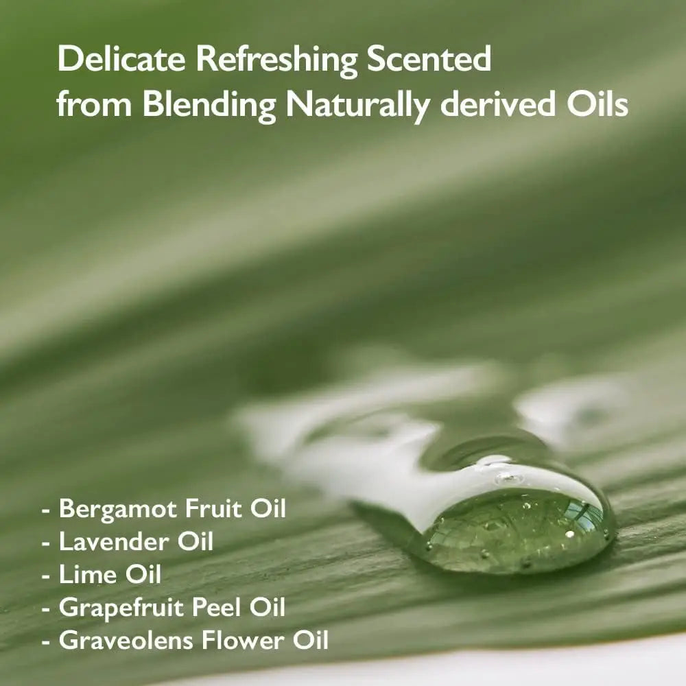 Close-up of a clear oil drop on a green leaf highlighting natural ingredients including bergamot fruit oil, lavender oil, lime oil, grapefruit peel oil, and graveolens flower oil used in haruharu wonder Black Bamboo Mist 150ml.