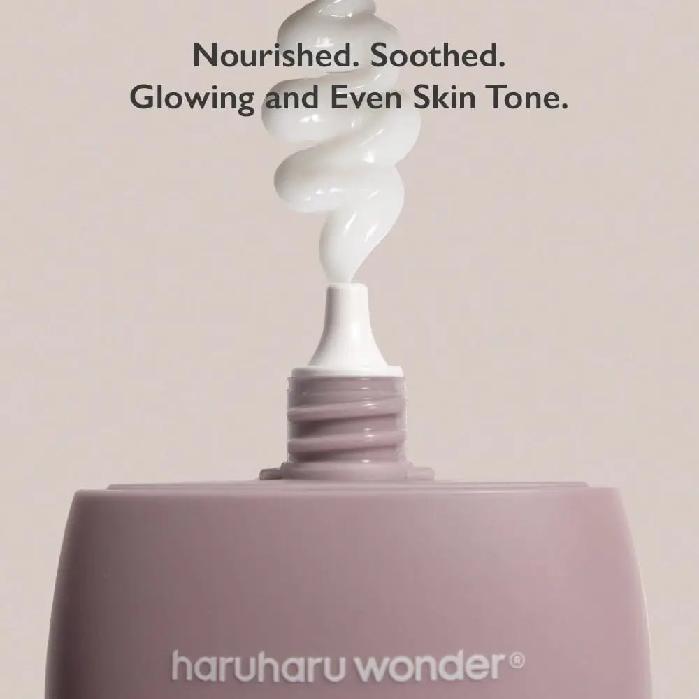 Close-up of haruharu wonder Black Rice 10 Hyaluronic Cream 50ml with creamy texture swirled above the tube, highlighting nourishment, soothing, and glowing even skin tone benefits.