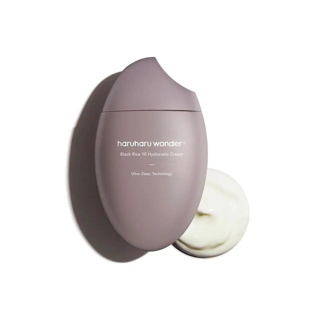 haruharu wonder Black Rice 10 Hyaluronic Cream 50ml in a sleek, modern mauve bottle with a dollop of smooth cream beside it on a white background