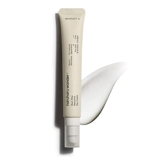 haruharu wonder Black Rice Bakuchiol Eye Cream 20ml tube with a creamy white texture swiped beside it on a white background, designed for targeted eye care.