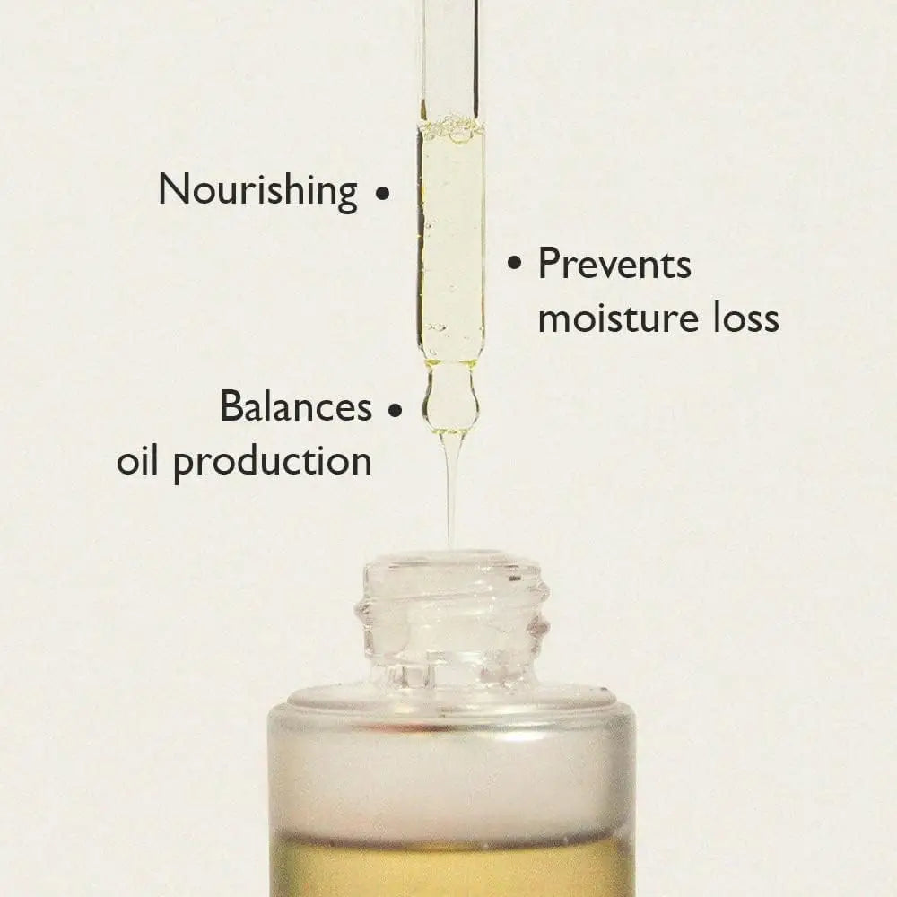 Dropper dispensing clear oil into a bottle with text highlighting benefits: nourishing, preventing moisture loss, and balancing oil production for haruharu wonder Black Rice Facial Oil 30ml.