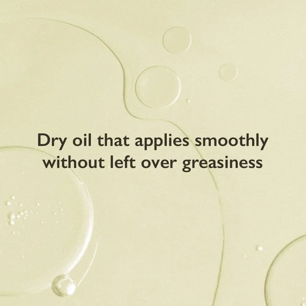 Close-up of clear oil droplets on a light background with text describing haruharu wonder Black Rice Facial Oil 30ml as a dry oil that applies smoothly without leftover greasiness.
