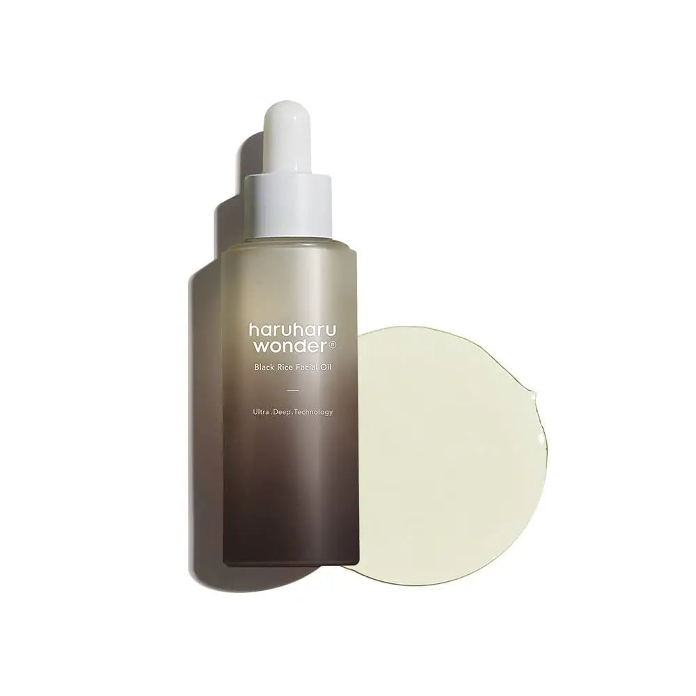 haruharu wonder Black Rice Facial Oil 30ml bottle with a dropper on a white background alongside a clear oil swatch, highlighting the facial oil's smooth texture.