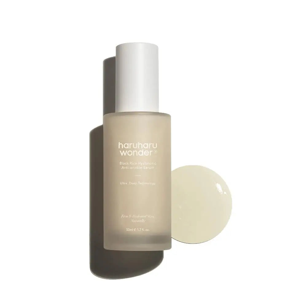 haruharu wonder Black Rice Hyaluronic Anti-Wrinkle Serum 50 ml bottle with a clear drop of serum on a white surface, showcasing a moisturizing and anti-aging skincare product
