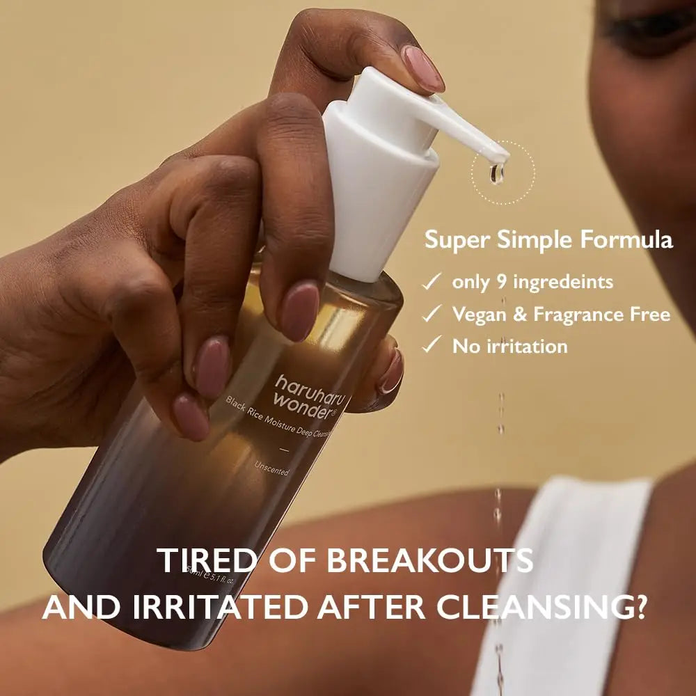 Hand holding a pump bottle of haruharu wonder Black Rice Moisture Deep Cleansing Oil 150ml with a drop of oil falling, highlighting its super simple formula with only 9 ingredients, vegan, fragrance-free, and no irritation.