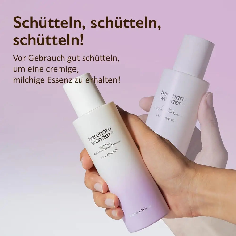 Hand holding a bottle of haruharu wonder Black Rice Probiotics Barrier Essence 120ml against a lavender background with German text instructing to shake well before use for a creamy, milky essence.