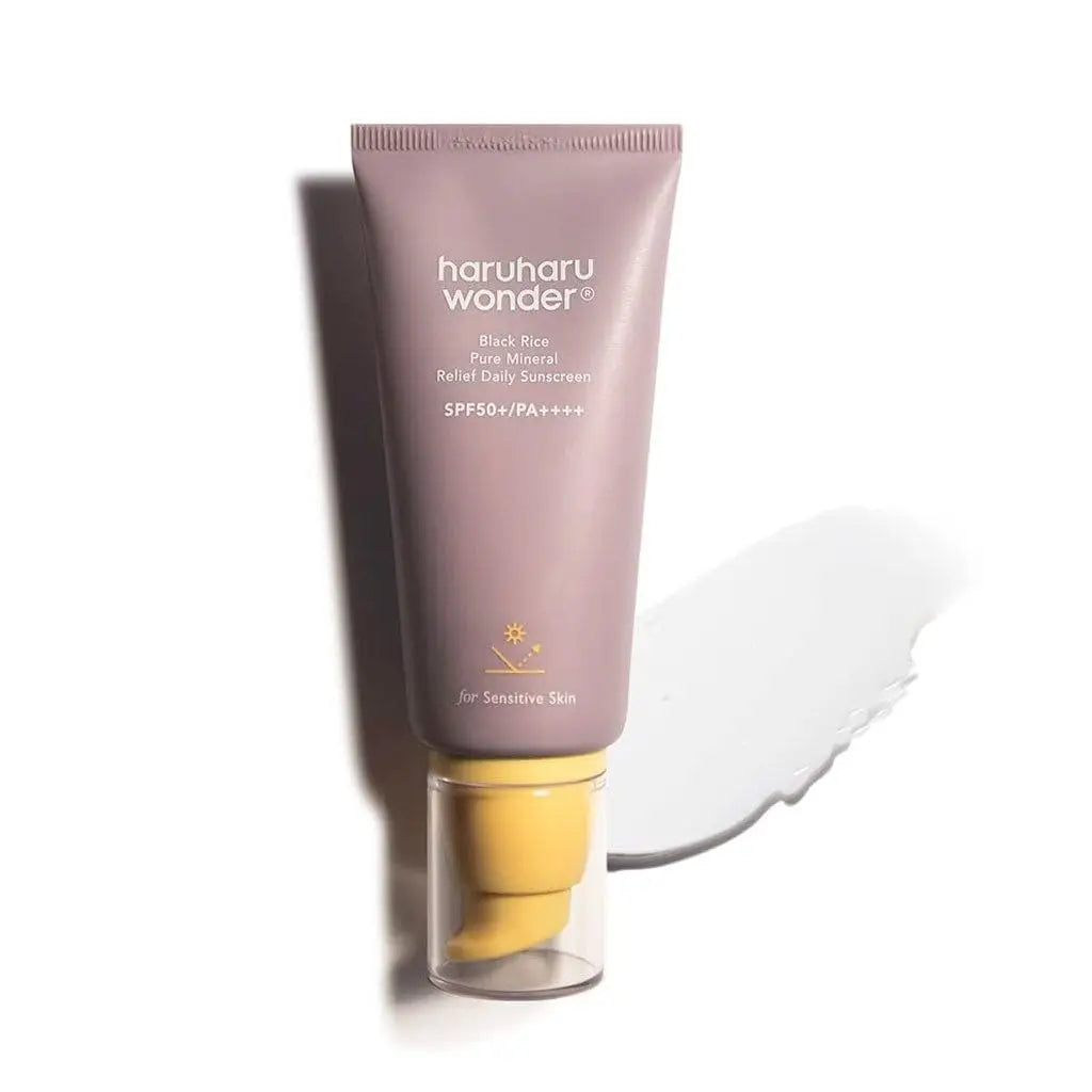 haruharu wonder Black Rice Pure Mineral Relief Daily Sunscreen 50ml in a mauve tube with yellow pump and white sunscreen smear for sensitive skin with SPF50+ and PA++++ protection