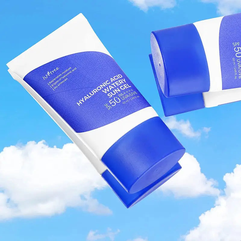 Isntree Hyaluronic Acid Watery Sun Gel 50 ml in a white and blue tube with SPF 50+ PA++++ protection against a bright blue sky with clouds background