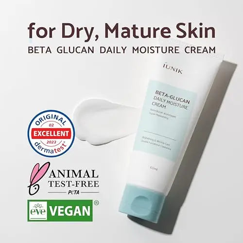 IUNIK Beta Glucan Daily Moisture Cream 60ml tube with light blue cap displayed on a white background with skincare cream texture and text emphasizing suitability for dry, mature skin, vegan and animal test-free certifications, and dermatest excellent rating.