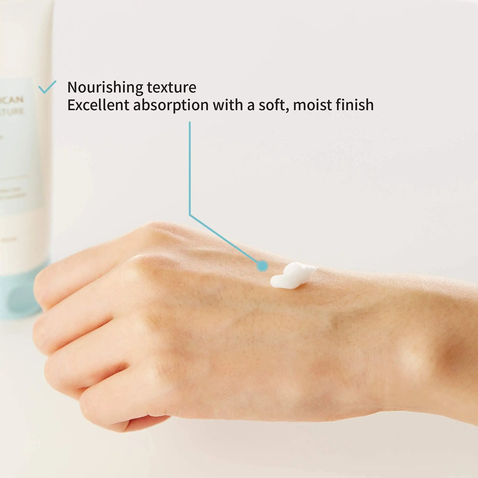 Hand applying creamy white lotion with highlighted nourishing texture and excellent absorption, promoting a soft and moist finish using IUNIK Beta Glucan Daily Moisture Cream 60ml + iUNIK Beta Glucan Power Moisture Serum 50ml, Deep Intense Hydration.
