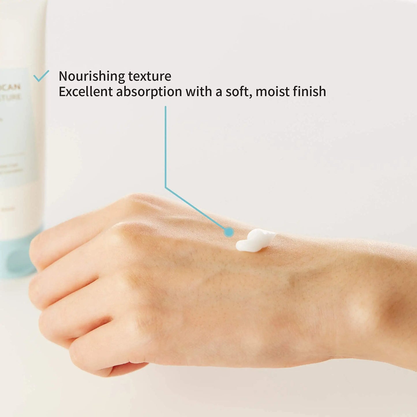 Close-up of a hand with a small amount of cream on the back, highlighting nourishing texture and excellent absorption with a soft, moist finish for iUNIK Beta Glucan Daily Moisture Cream 60ml + iUNIK Propolis Vitamin Sleeping Mask Cream, 60ml.