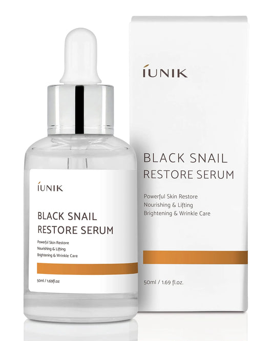 iUNIK Black Snail Restore Serum 50ml in clear glass dropper bottle with white and gold label beside matching white and gold product box for skin nourishment and wrinkle care