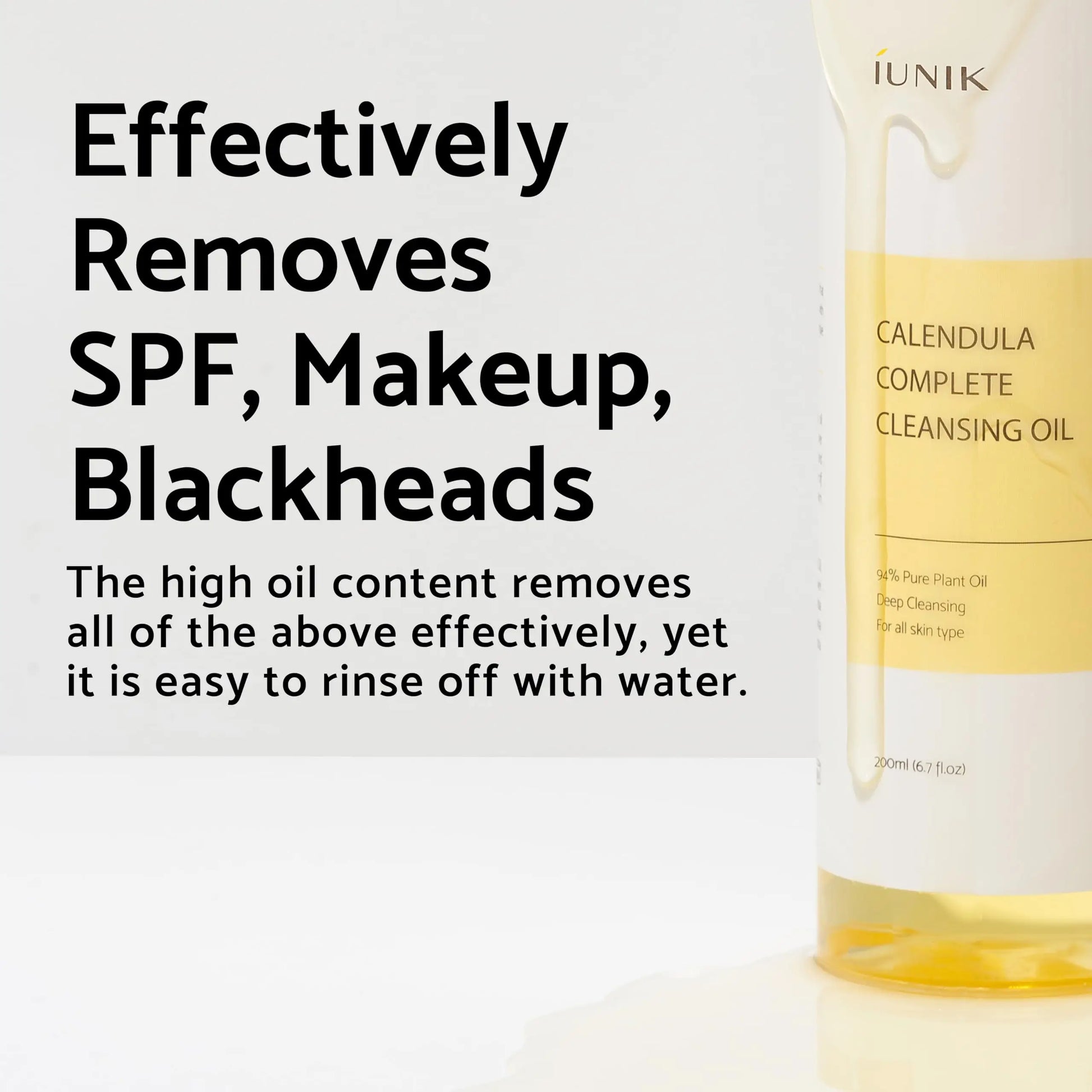 Close-up of a partially visible bottle of iUNIK Calendula Complete Cleansing Oil, 200ml, with oil dripping down the side and text describing its effectiveness at removing SPF, makeup, and blackheads while rinsing off easily with water.