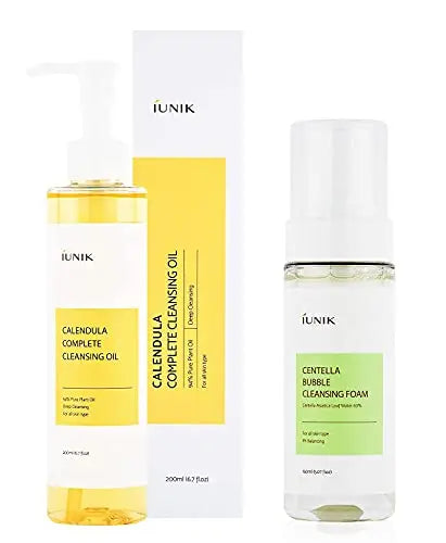 Bottle and foam pump dispenser of iUNIK Calendula Complete Cleansing Oil, 200ml + iUNIK Centella Bubble Cleansing Foam, 150ml with white and yellow-green labels on a white background.