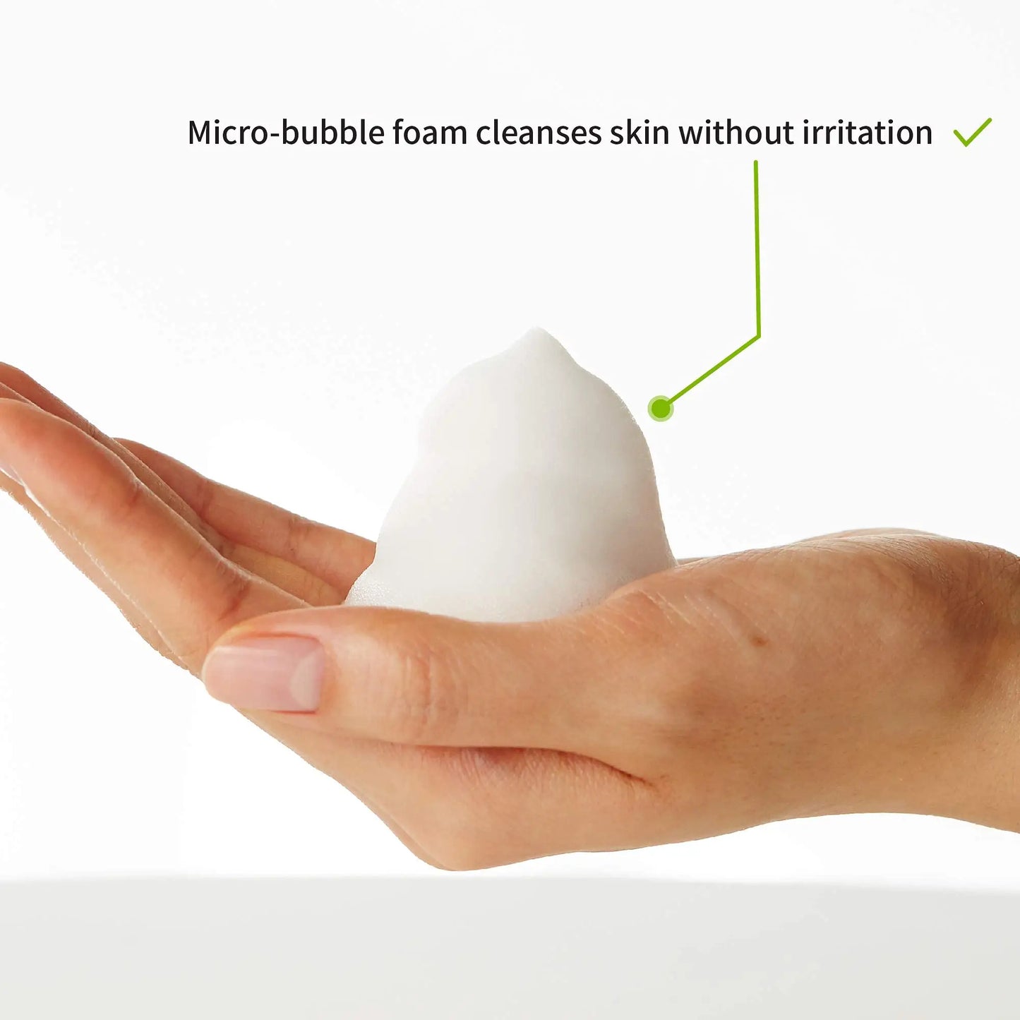 Close-up of a hand holding dense micro-bubble foam demonstrating gentle cleansing, highlighting the iUNIK Centella Bubble Cleansing Foam, 150ml + iUNIK Tea Tree Relief Toner 200ml product features.