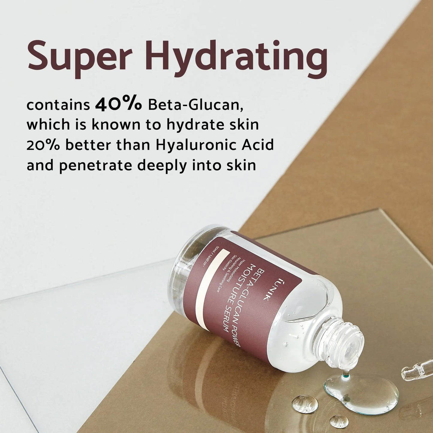 iUNIK Centella Calming Daily Sunscreen 60ml + iUNIK Beta Glucan Power Moisture Serum 50ml bottle lying on a reflective surface with clear serum droplets, highlighting super hydrating properties with 40% Beta-Glucan.