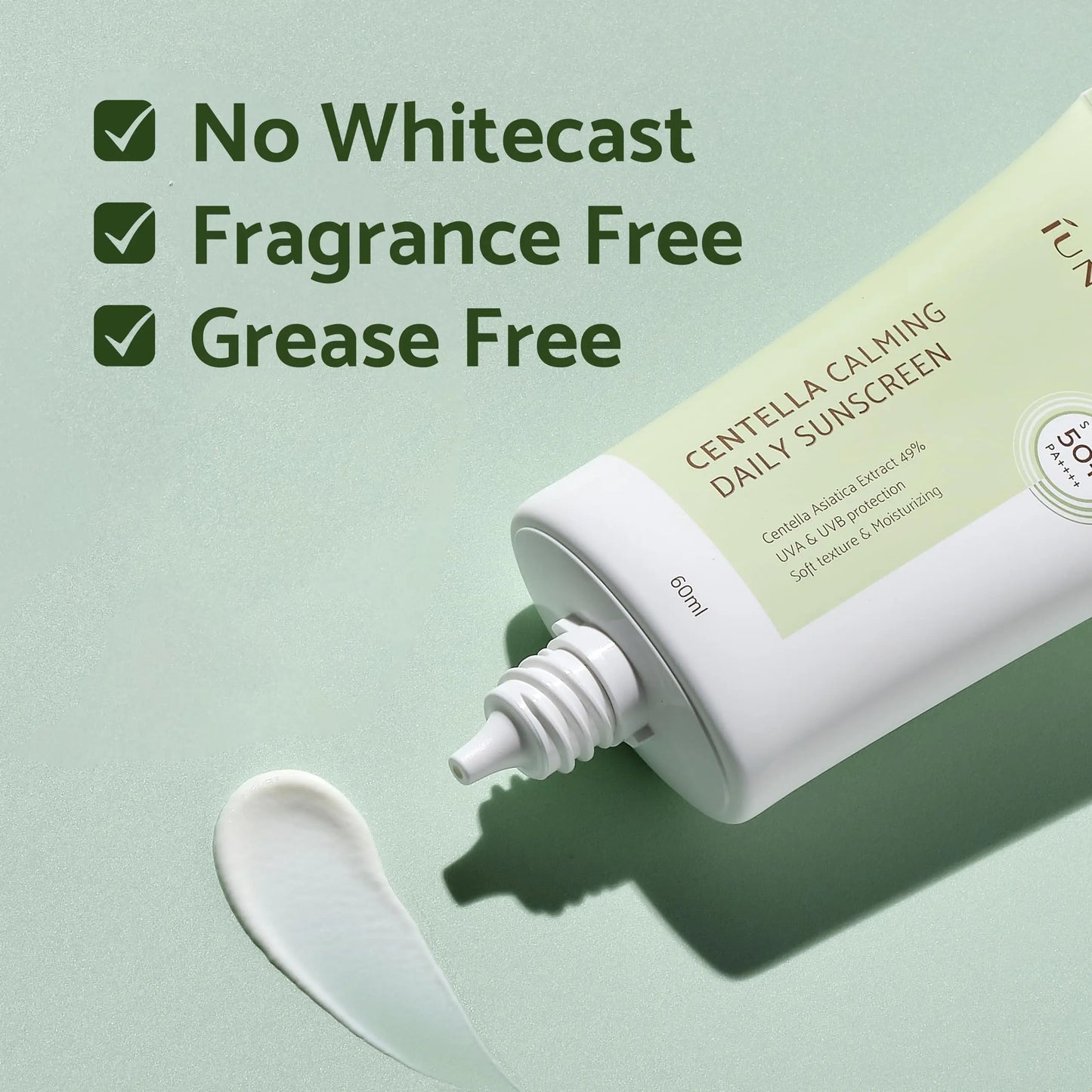 iUNIK Centella Calming Daily Sunscreen 60ml + iUNIK Centella Bubble Cleansing Foam, 150ml with text highlighting no whitecast, fragrance free, and grease free benefits on a soft green background.