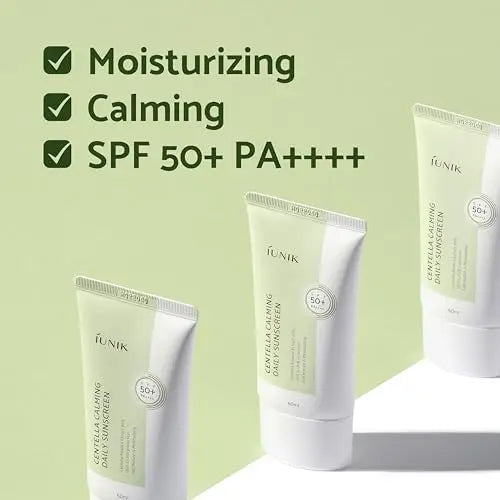 Three tubes of iUNIK Centella Calming Daily Sunscreen 60ml with text highlighting moisturizing, calming benefits, and SPF 50+ PA++++ protection on a light green background.